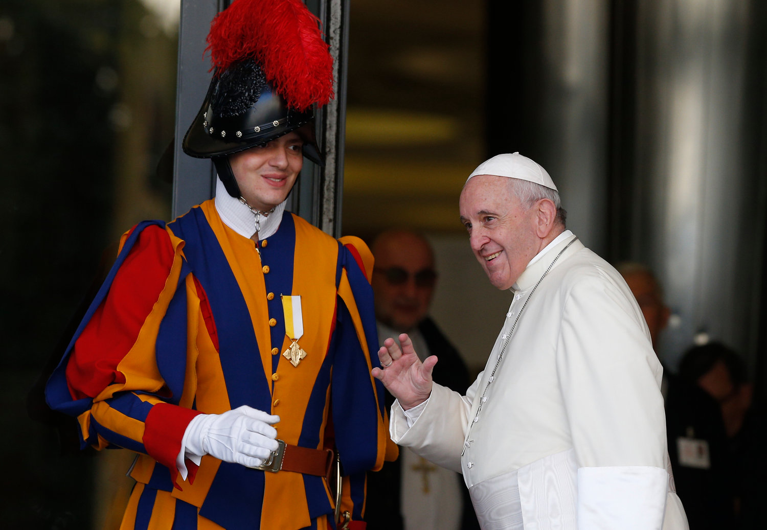 Pope Francis passes a Swiss Guard as he arrives for a session of the Synod of Bishops for the Amazon at the Vatican Oct. 15, 2019.